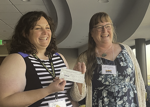 Crystal Morgan receiving the Student Paper Award